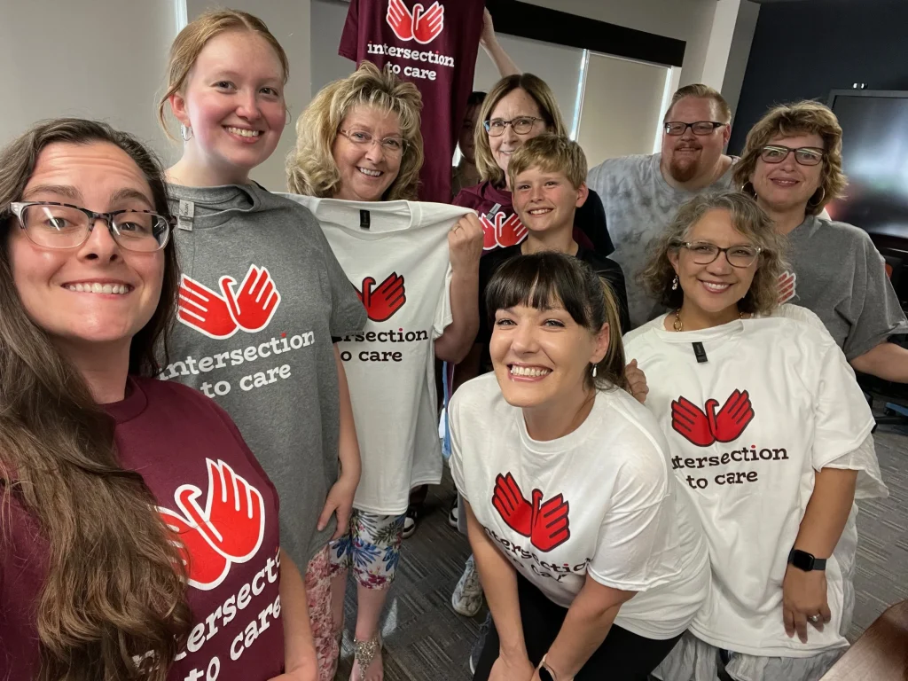 Group photo of volunteers supporting women-led community impact in Topeka.