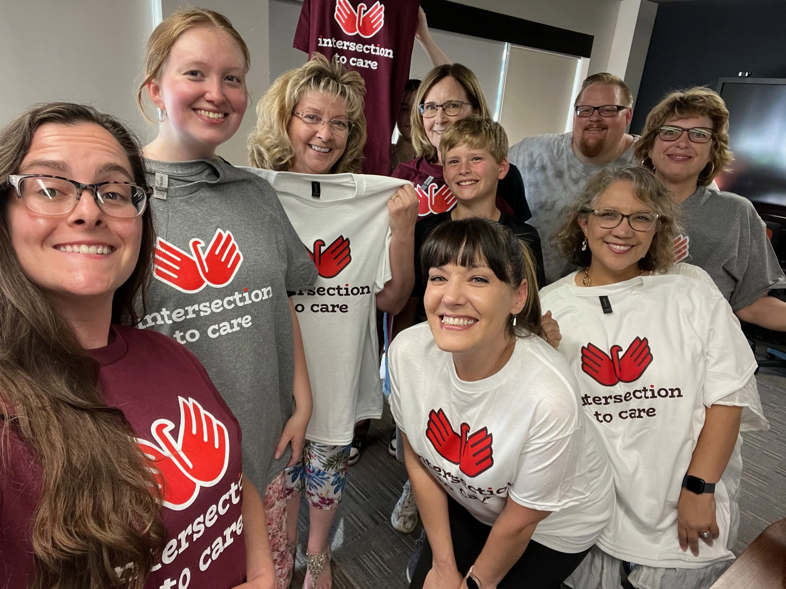 Group photo of volunteers supporting women-led community impact in Topeka.