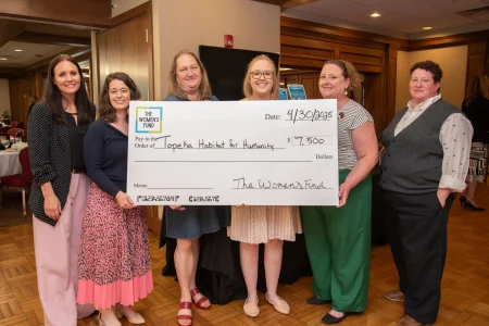 Group presenting a $7,500 grant check to Topeka Habitat for Humanity, reflecting women-led philanthropy Topeka KS.